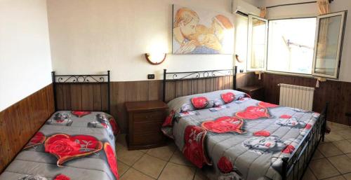 מיטה או מיטות בחדר ב-Camere Sul Mare