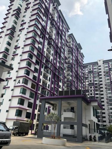 a tall apartment building with a tree in front of it at Kyra The Heights Residence Condo Ayer Keroh Melaka WiFi, Netflix & Pool in Ayer Keroh