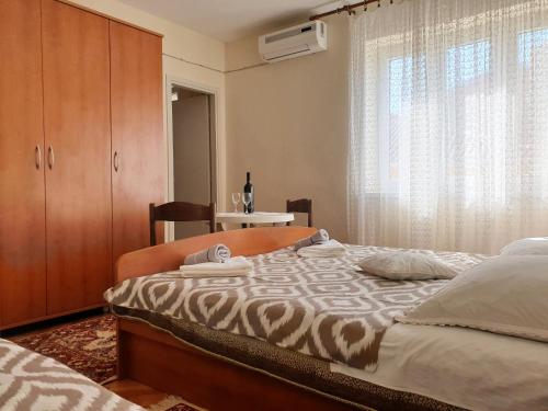 Postel nebo postele na pokoji v ubytování Guest House Miro