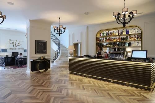 a lobby of a hotel with a bar at Arté Boutique Hotel in Tirana