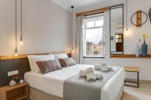 Ένα ή περισσότερα κρεβάτια σε δωμάτιο στο Harismari Cozy Hotel