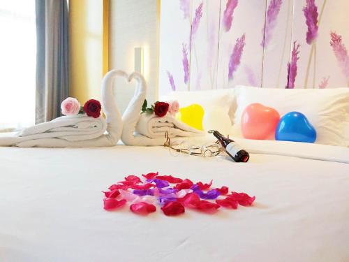 Katil atau katil-katil dalam bilik di Lavande Hotel Taixing Jiangping Road