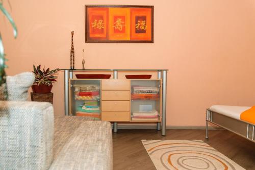 a room with a desk and a dresser at Kiev Central Apartment in Kyiv