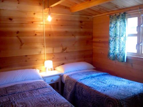 Ένα ή περισσότερα κρεβάτια σε δωμάτιο στο Camping la Pedrera