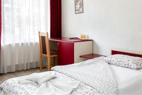Ένα ή περισσότερα κρεβάτια σε δωμάτιο στο Family Hotel Aleks