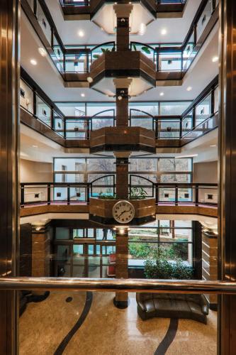 a view of the lobby of a building with a clock at Hotel Belweder in Ustroń