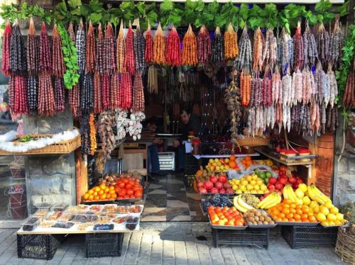 a market with a bunch of fruits and vegetables at Hotel MMG in Tbilisi City