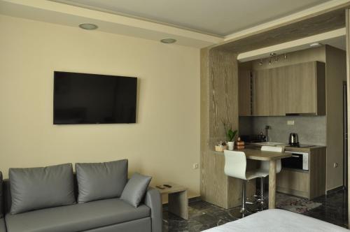 A television and/or entertainment centre at Agias Sofias Street Luxurious Studio