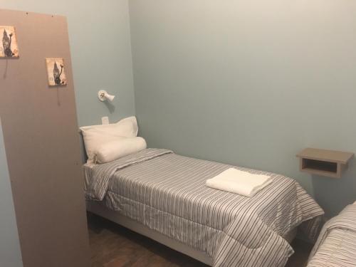 Una cama o camas en una habitación de Altos de Ayelen