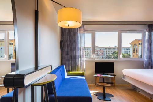 Aparthotel Adagio access Montpellier Centre tesisinde bir oturma alanı