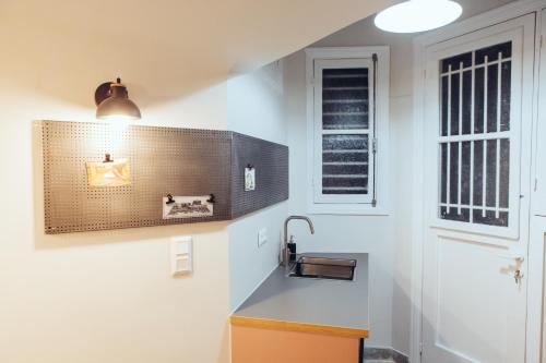 a kitchen with a sink and a window at we saw athens in Athens