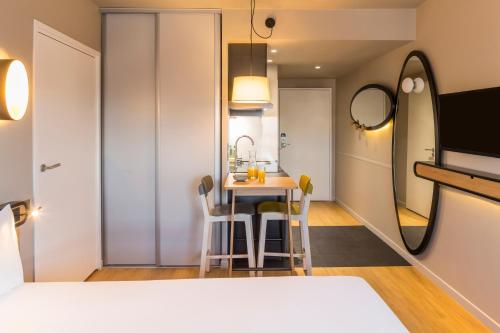 a small dining room with a table and chairs at Aparthotel Adagio access Montpellier Centre in Montpellier