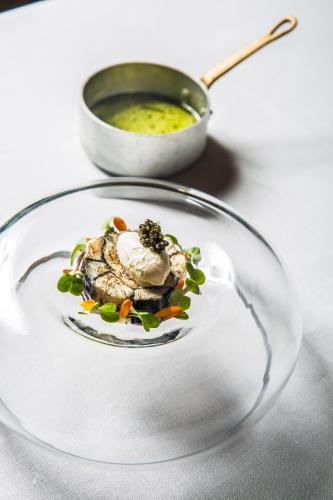 a plate of food on a table with a bowl of soup at Can Simoneta - Adults Only in Canyamel