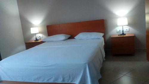 Postel nebo postele na pokoji v ubytování Hotel Majestic