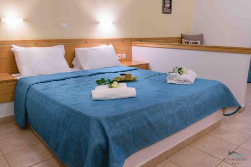 Postel nebo postele na pokoji v ubytování Junior Hotel