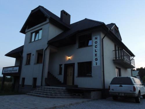 a building with a car parked in front of it at BoomerangHouse in Wrocław