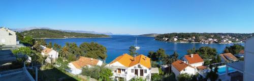 an aerial view of a town and a lake at Apartments Vukas in Lumbarda