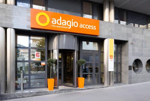 a building with an adelaide access sign on it at Aparthotel Adagio Access La Défense - Léonard De Vinci in Courbevoie