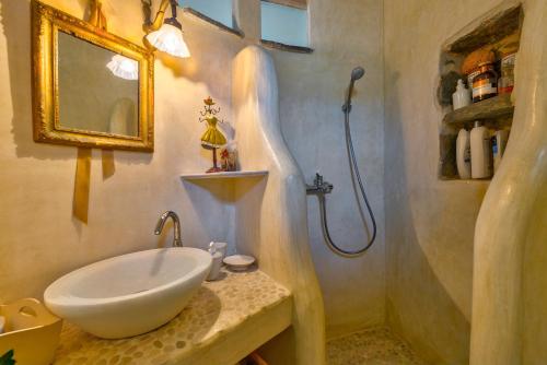 a bathroom with a sink and a shower at MEGAS GIALOS HARMONY in Megas Gialos - Nites