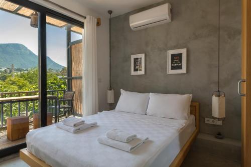 Postel nebo postele na pokoji v ubytování Daphnis Hotel