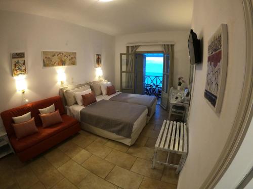 Ένα ή περισσότερα κρεβάτια σε δωμάτιο στο Hotel Mathios