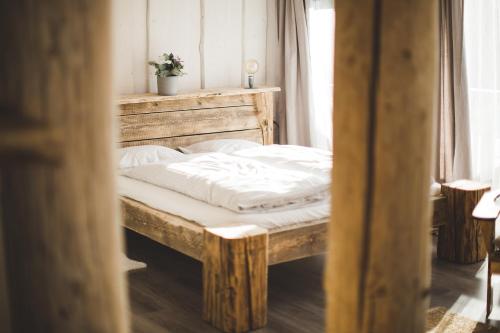 Postel nebo postele na pokoji v ubytování Gazdovský dvor B&B s Mini Wellness