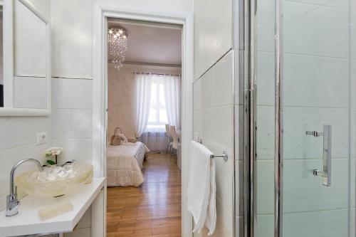 a bathroom with a sink and a shower at Luxury Rome Guest House in Rome