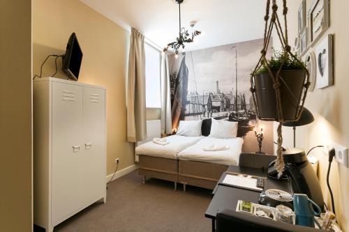 Postel nebo postele na pokoji v ubytování Hotel Heere