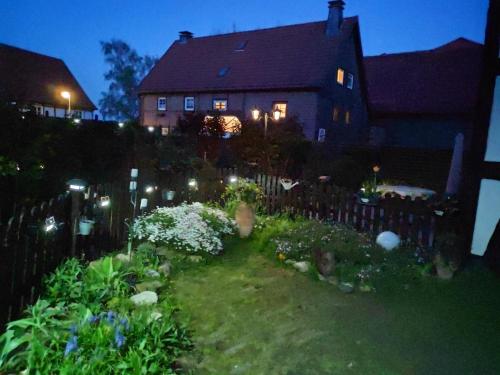 a garden in front of a house at night at Annabell in Soest