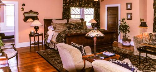 
a living room filled with furniture and a fireplace at Black Walnut B&B Inn in Asheville
