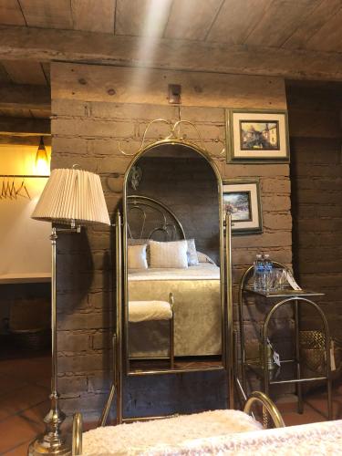 a bedroom with a canopy bed in a room at Huehcani - Xamikal in Zacatlán