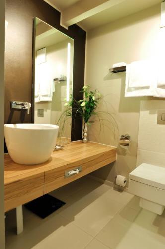 a bathroom with a white sink and a mirror at Stage47 in Düsseldorf