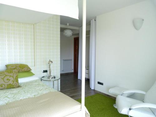 Postel nebo postele na pokoji v ubytování Hotel Garazar