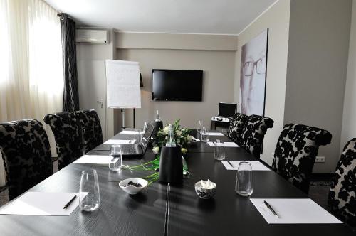 a conference room with a long table and chairs at Stage47 in Düsseldorf