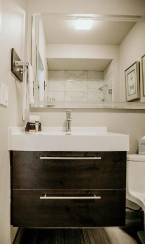 a bathroom with a sink and a toilet at Geyserville Inn in Geyserville
