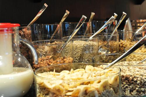 a bunch of glass jars filled with different types of food at Stage47 in Düsseldorf