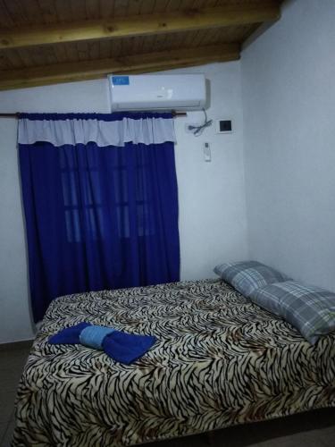 เตียงในห้องที่ DOÑA ROSA