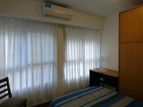 Postel nebo postele na pokoji v ubytování Apartamento Avenida de Mayo 1316