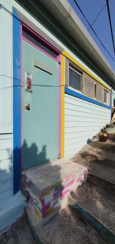 a colorful garage door with a box in front of it at Magenta in Donghae
