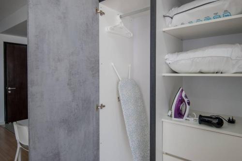 a bedroom with a door open to a closet at USJ One HomeStay @ Subang HomeStay in Subang Jaya