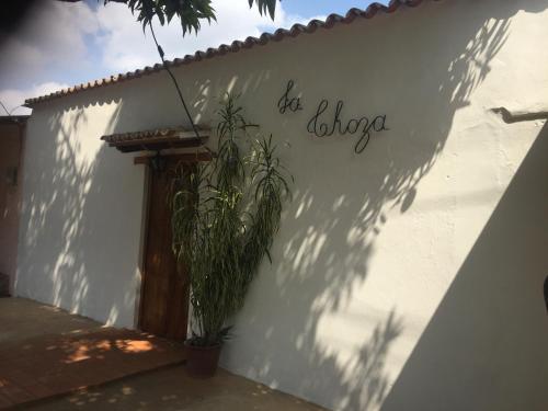 a white wall with the words eat dialogue on it at LA CHOZA in Mompos