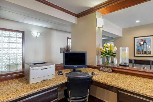 a computer sitting on a desk in a room at Comfort Suites North Dallas in Dallas