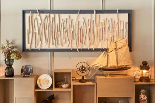 a room with a bunch of utensils hanging from a wall at Hotel Resol Yokohama Sakuragicho in Yokohama