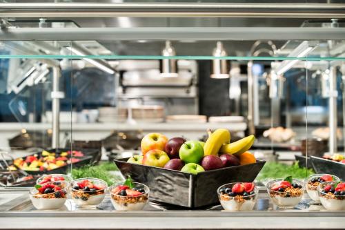 a bunch of fruits and vegetables in a kitchen at Texas A&M Hotel and Conference Center in College Station