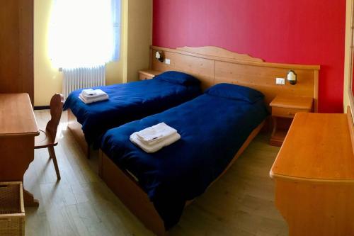 Llit o llits en una habitació de Lozzo di Cadore - Dolomiti - Piazza IV novembre