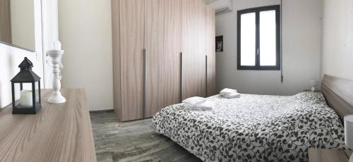 Posteľ alebo postele v izbe v ubytovaní Casa Vacanza Gemini