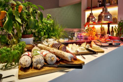 a buffet with different types of food on a table at ABC Hotel in Blankenberge