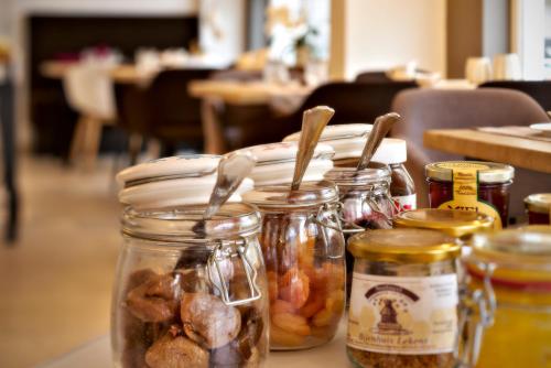 a group of jars of food on a table at ABC Hotel in Blankenberge