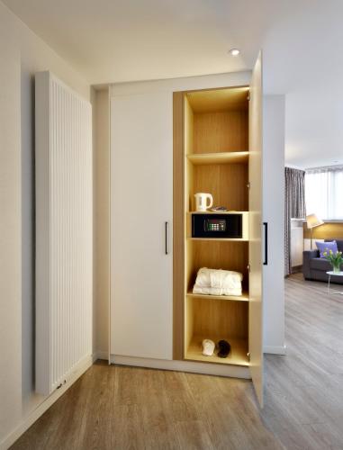 a room with a closet with a book shelf at ABC Hotel in Blankenberge