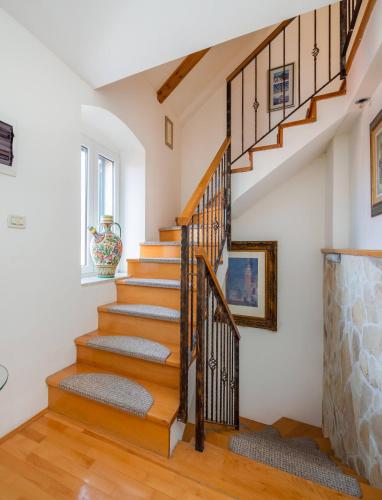 a staircase in a home with wood floors at Boutique Guest Accommodation Zephyrus in Split